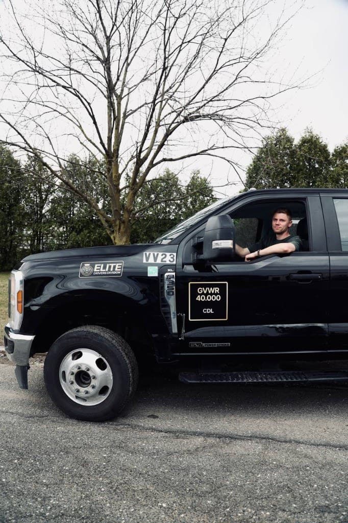 OLC dispatch on the road — a driver in the company truck